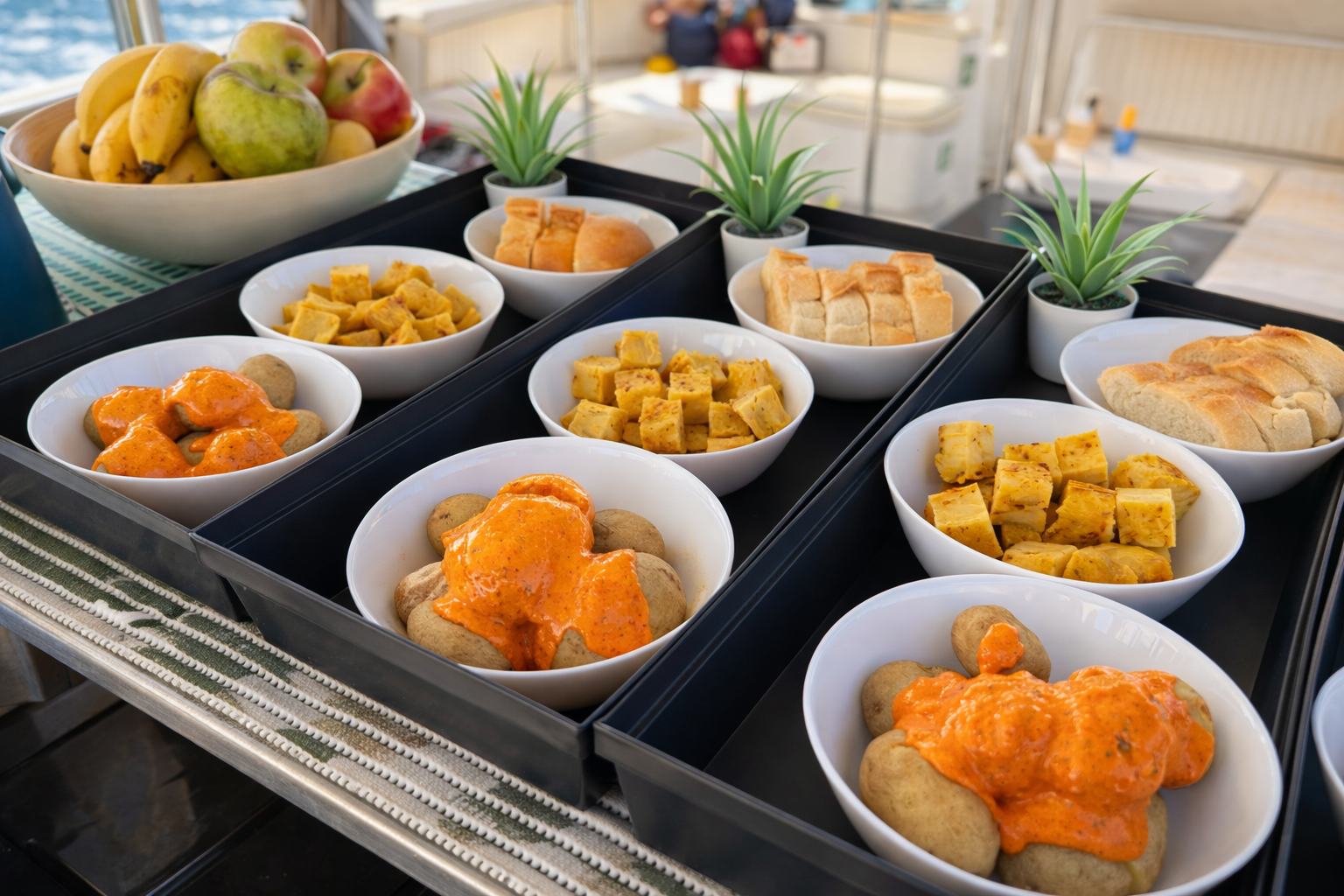 Traditional Canarian food with papas arrugadas and mojo sauce served during a boat trip in Puerto de Mogan Gran Canaria