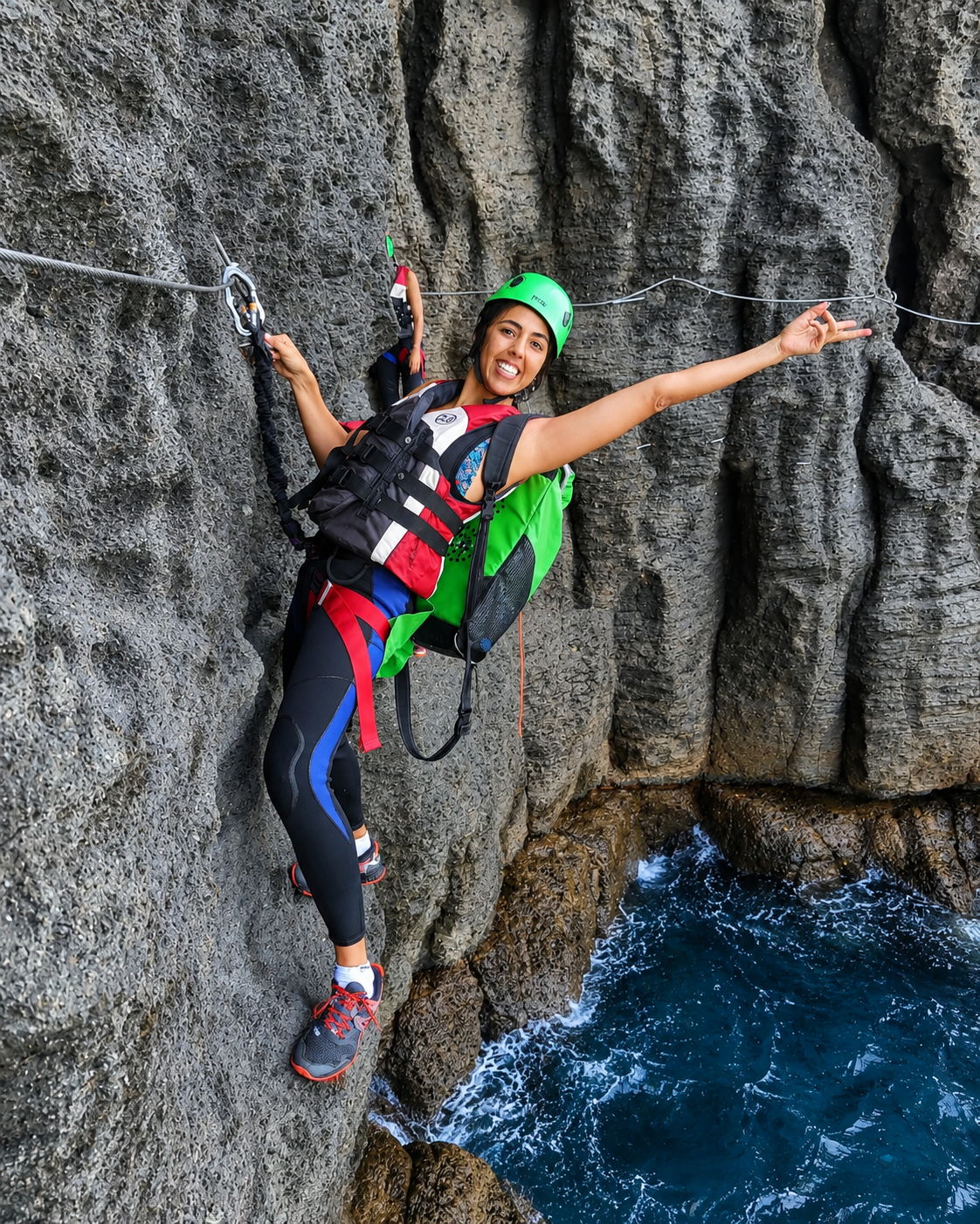 Guest jumping off a cliff during a coasteering adventure in Gran Canaria