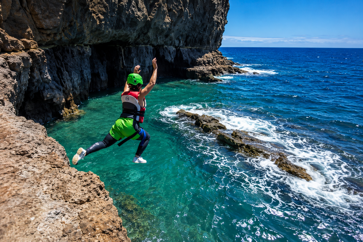 coasteering-gran-canaria-zipline-coast Guest crossing a zipline over the water on a coasteering tour in Gran Canaria